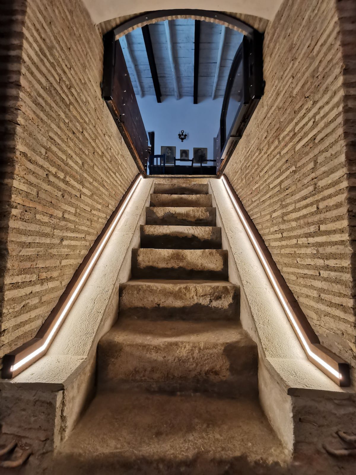 The seventeenth-century brick staircase, lit from above